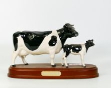 Beswick Friesian cow and calf on plinth
