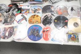 A collection of 1980's & later picture disc records including Rolling Stones, The Killers , Sigsig