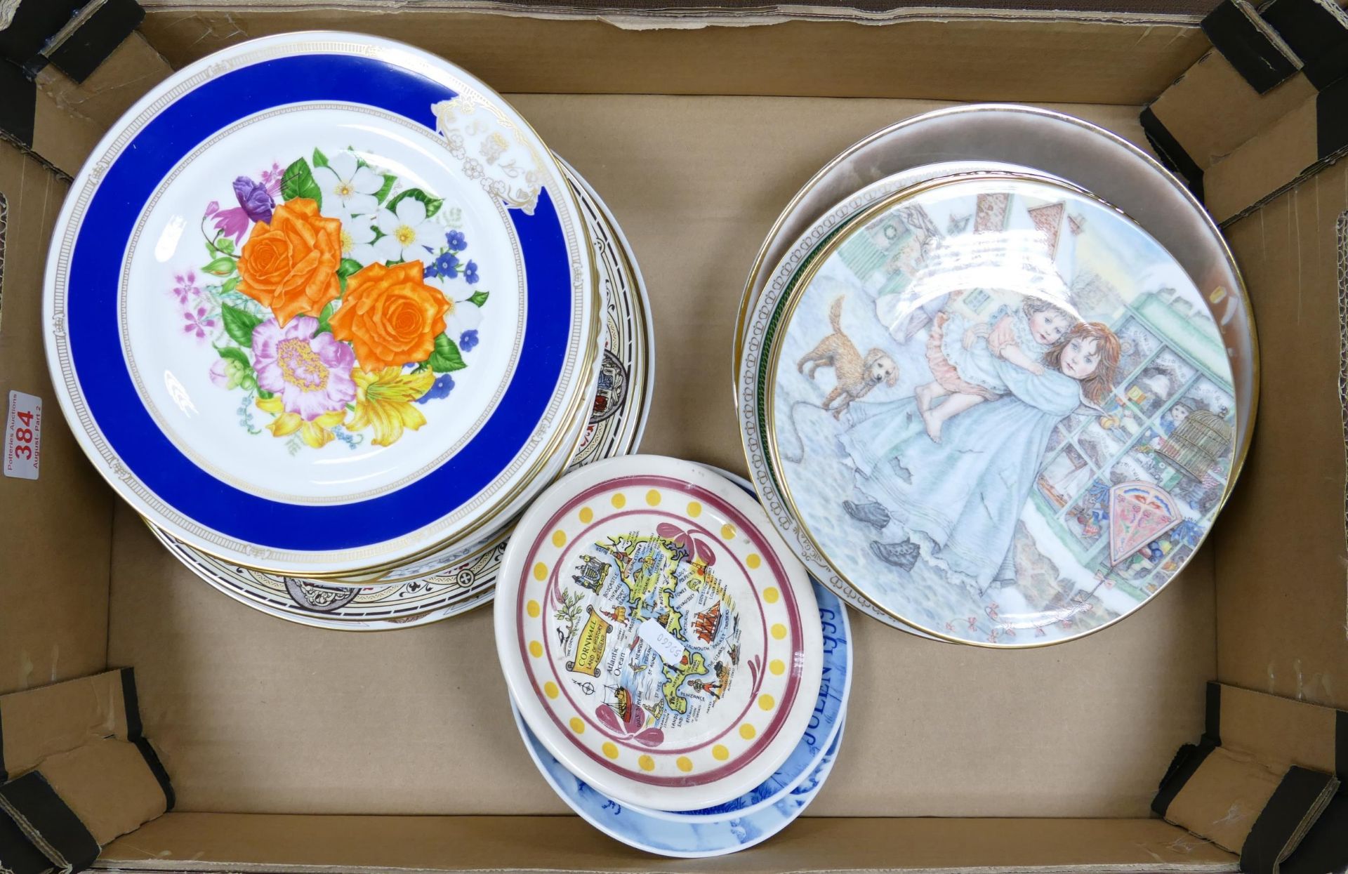 A collection of decorative wall and cabinet plates