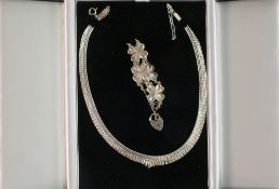 Striking hallmarked silver choker necklace in display box, together with fancy floral silver