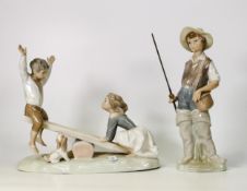 Lladro figure of a boy fishing together with Nao figure of children playing on a see saw (2)