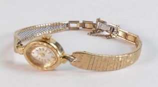 Bulova ladies pocket watch in 14k gold case and plated bracelet, winds tick, sets & runs.