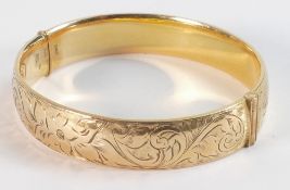 9ct gold bangle with metal core, so NOT solid gold, internal dimensions 60mm x 55mm, weight 22.86g.