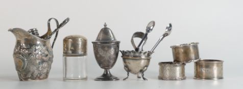A collection of Silver items comprising serviette rings,Jug, tongues, solid silver 255g, and two