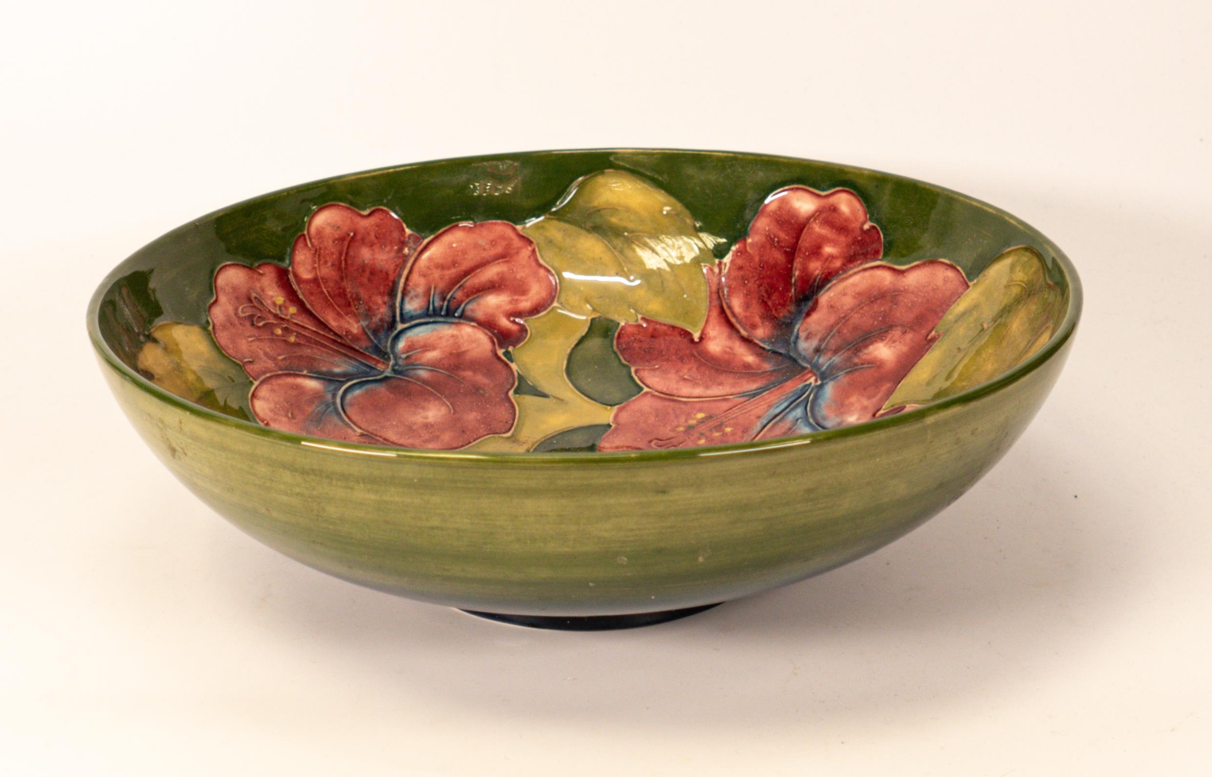 Moorcroft Hibiscus bowl on green background. Diameter 26cm