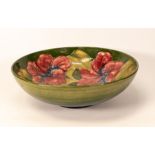 Moorcroft Hibiscus bowl on green background. Diameter 26cm