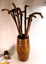 A collection of vintage walking sticks & similar oak barrel shaped stick stand