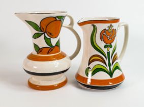 Pair of Wade stylised tree pattern water jugs, height of tallest 20cm. These were removed from the