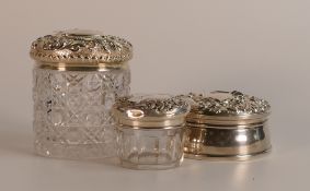 Silver hinged round jewellery box and two Silver topped cut glass jars. (3)