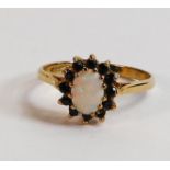 9ct gold ladies dress ring, set with opal and sapphires, size N, 1.9g.