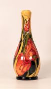 Moorcroft vase decorated with stylised red tulips. Dated 2008, height 20.5cm. Boxed