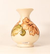 Moorcroft Hibiscus on cream ground vase. Height 13.5cm