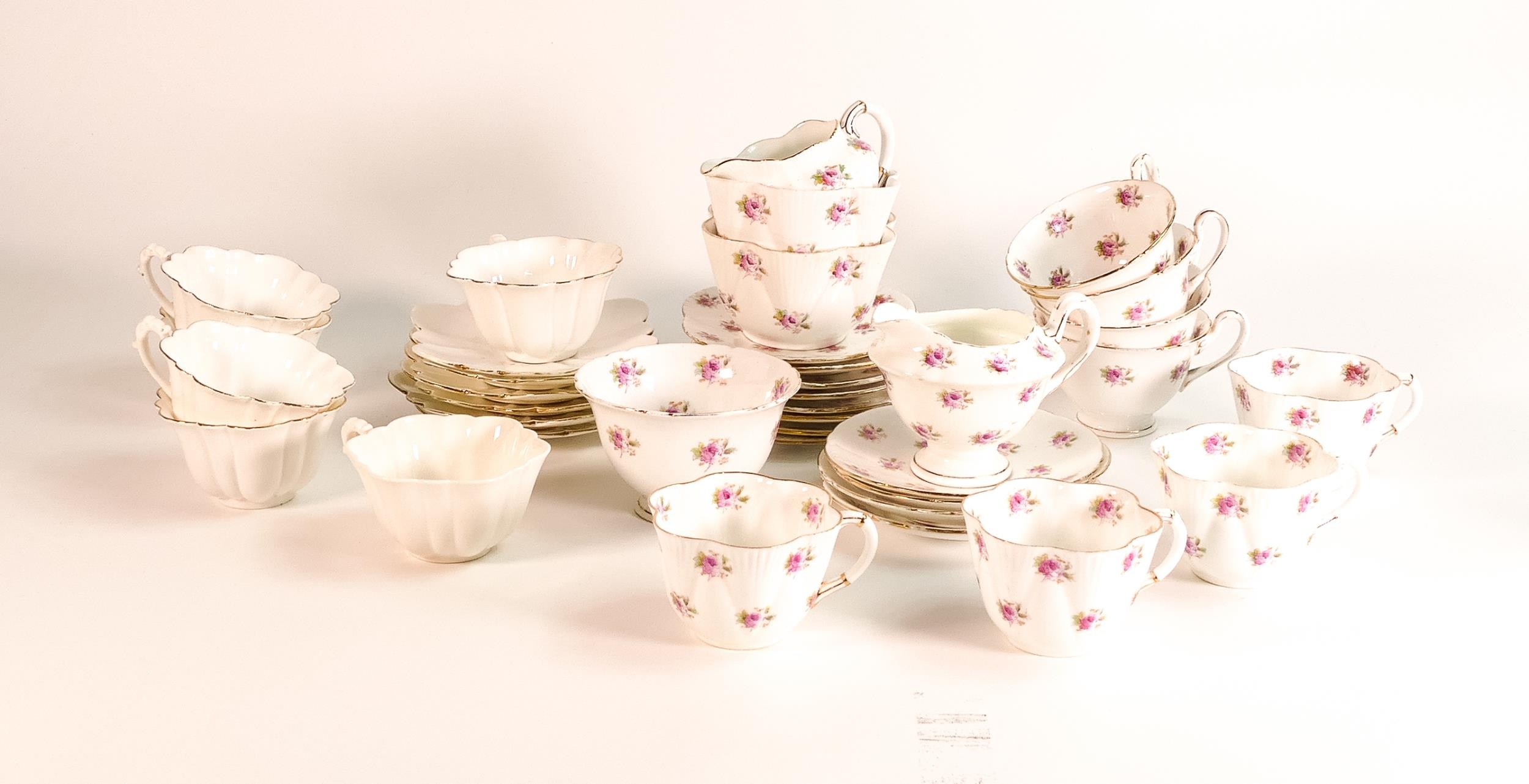 A collection of Wileman & Co pattern 7447 to include 4 coffee cups and saucers, Gainsborough cream