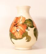 Moorcroft Hibiscus on cream vase. Height 21cm crazing