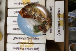 A collection of boxed von christian luckel plates, limited edition plates decorated with landscapes