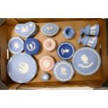 A collection of multi coloured Wedgwood jasperware including lidded boxes, wall plates, vases etc