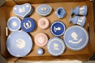 A collection of multi coloured Wedgwood jasperware including lidded boxes, wall plates, vases etc