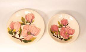 Moorcroft Magnolia on cream wall charger and shallow bowl. Largest diameter 26cm