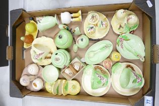 A collection of Australian Carlton ware to include condiments sets, perserve pots, cups, saucers,