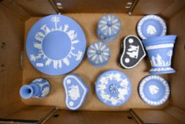 A collection of Wedgwood Blue Jasperware including pin dishes, lidded boxes, vases etc (some damages