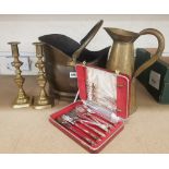 A mixed collection of items to include a pair of brass candle stick holders, large brass jug, coal