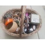 A basket of a large collection of mixed costume jewellery