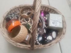 A basket of a large collection of mixed costume jewellery