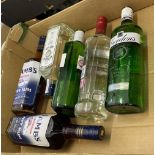 A collection of 6 70cl bottles of sealed spirits to include Smirnoff Vodka, Gordons Gin, Lambs