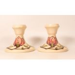 A pair of Magnolia on cream candlestick. Height 9cm