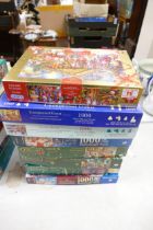 A collection of Falcon, Gibson, Ravenburger & similar 1000 Piece Jigsaw Puzzles (vendor states