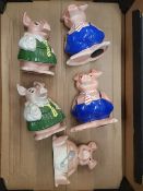 A collection of 5 Wade natwest piggy banks