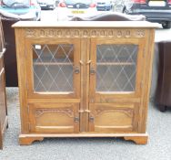 A 20th Century Priory Style China Cabinet. Height: 100cm x Width: 109cm