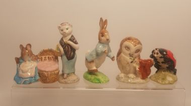 A collection of Beatrix Potter figures to include Beswick Susan, Hunca Munca, Peter Rabbit, Old Mr