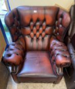 An Ox-blood Leather Chesterfield Wingback Armchair
