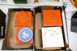 A collection of boxed Spode Christmas plates together with two Wedgwood blue jasperware Christmas