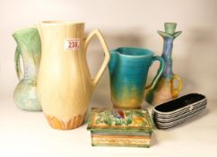A collection of Beswick and Sylvac to include jugs, candlestick, lidded box and flower posy (6)