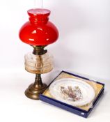 Brass and glass oil lamp together with a boxed commemorative plate , Height of lamp 54cm