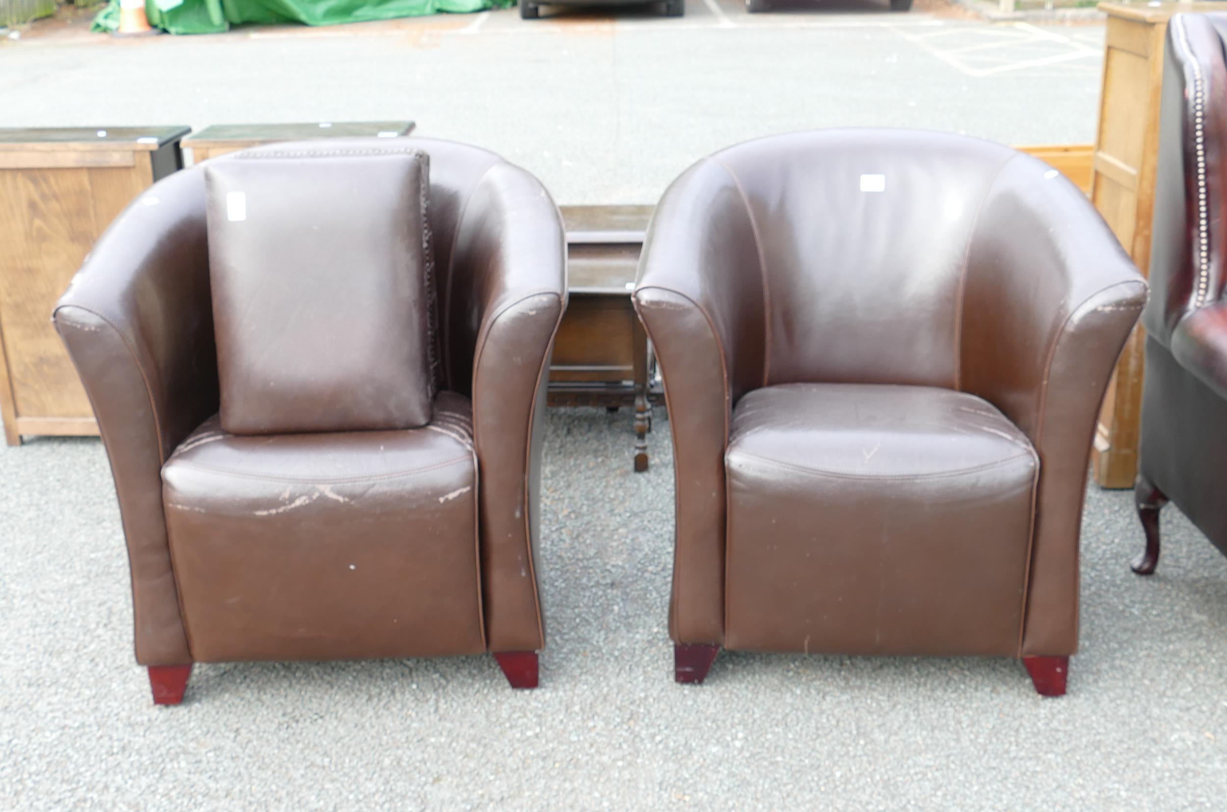 Two Club Armchairs with two unmatching footstools (4)