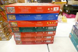 A collection of Hop The Hosue of Puzzles & similar Christmas Theme 1000 Piece Jigsaw Puzzles (vendor
