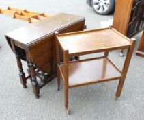 A Gate-legged Darkwood Table together with a mid century drinks trolley