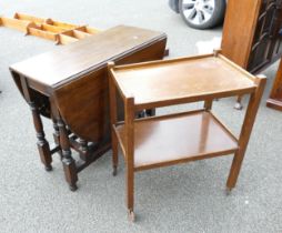 A Gate-legged Darkwood Table together with a mid century drinks trolley