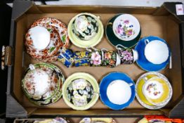 A collection of cups and saucers to include Royal Albert provincial flowers, Coalport blue and