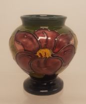 Moorcroft vase in the clematis pattern on blue/green ground 9cm high.