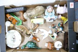 A collection of ceramic figures to include Szeiler hippo, Goebel girl figurine , Beswick Stag (