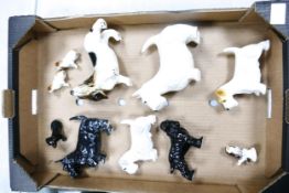 A collection of ceramic dogs to include Wade, Adderley etc ( 1 tray)