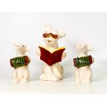 Three Beswick figures to include Dog With Glasses Reading A Book 831 together with two Dog Playing