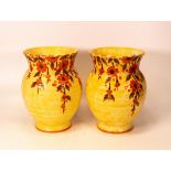 A pair of Crown Devon Fielding Mattita vases decorated with stylised flowers, marked M51 to base.