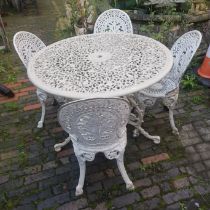 Painted white aluminium patio table and four chairs. Diameter of table 109cm