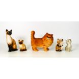 A mixed collection of ceramic cat figures to include Royal Doulton Siamese Cat HN2655, Beswick