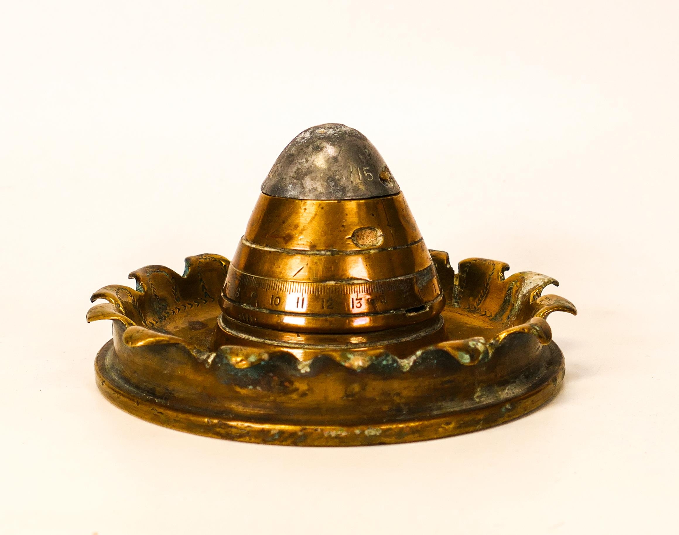 Trench art shell base and detinator , marked 1916 45 TN HOW with broad arrow mark to base